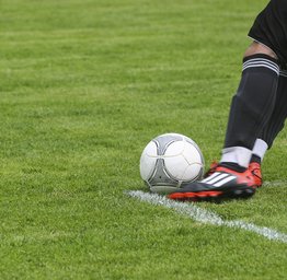 foot kicking soccer ball