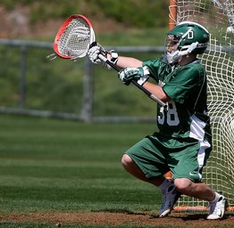 lacrosse goalie stopping ball